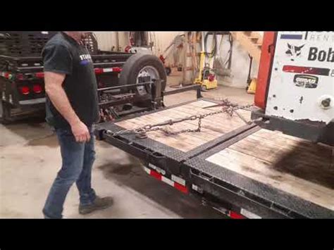 how to tie down a skid steer|how to chain down skid steer.